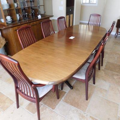 Item 30 Danish more modern dining set with two arm chairs and six side chairs length is 82 depth 40 inches