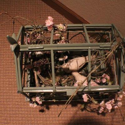 LOT #282: Large Home deco Bird Cage w/ artificial floral arrangement inside.