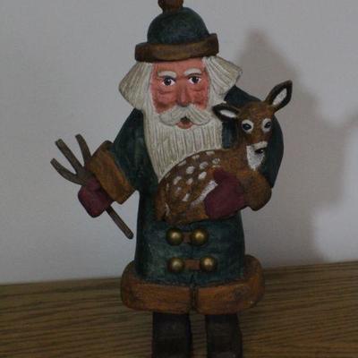 LOT #343: Handmade Wood Carved Santa Claus Rescuing Deer 