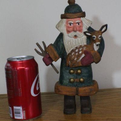 LOT #343: Handmade Wood Carved Santa Claus Rescuing Deer 