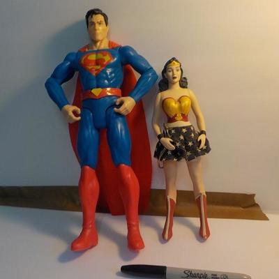 "Superman and Wonder women dolls.