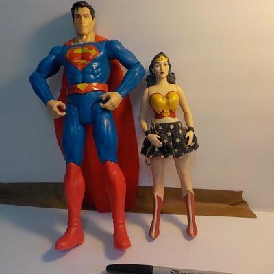 "Superman and Wonder women dolls.