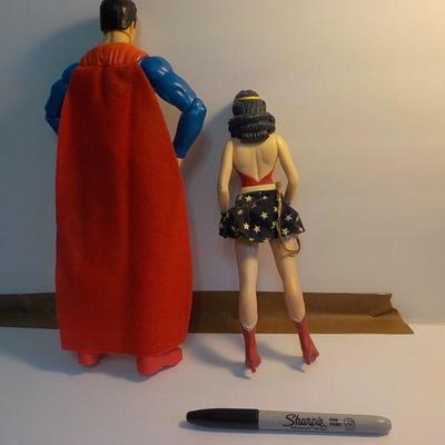 "Superman and Wonder women dolls.