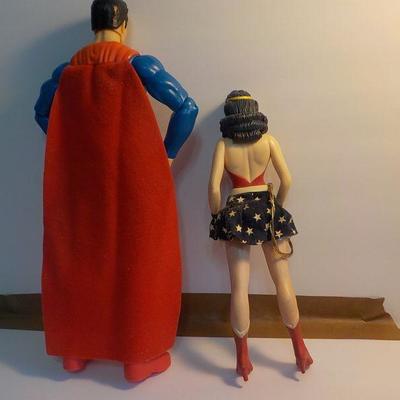 "Superman and Wonder women dolls.