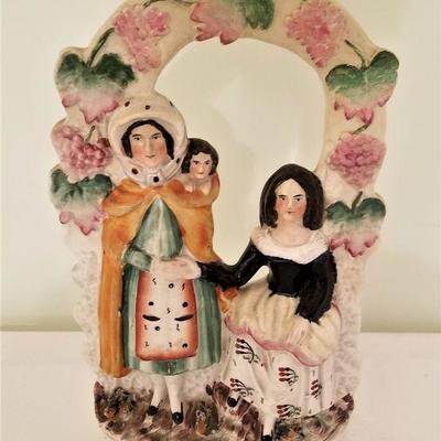 Lot #32  19th Century Staffordshire Figure - Two women with child