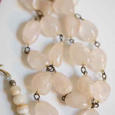 #6-12  Natural stone grouping of necklaces to include white coral bead. 