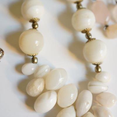#6-12  Natural stone grouping of necklaces to include white coral bead. 
