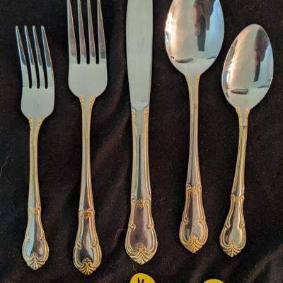 Lot 204 - Two Tone Stainless Silver and Gold Flatware - 60 pieces 