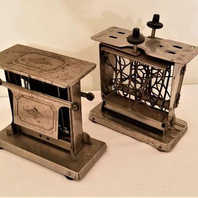 Lot #61  Pair of Antique Toasters