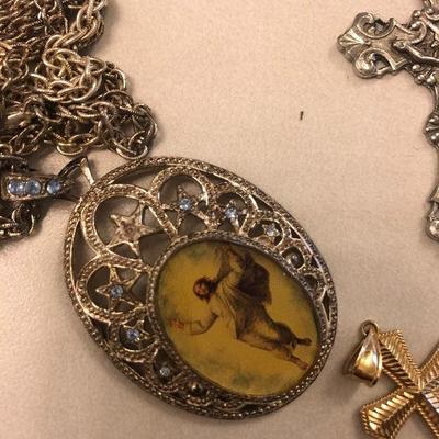#189 4 piece religious jewelry bundle