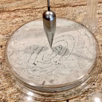 LOT 104  PERPETUAL MOTION PLUMB BOB ACRYLIC STAND 
