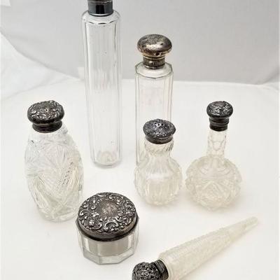 Lot #98  Collection of 7 Vanity bottles with Sterling Silver Tops