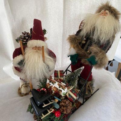 Lot #598 Christmas Santas pushing Sled 