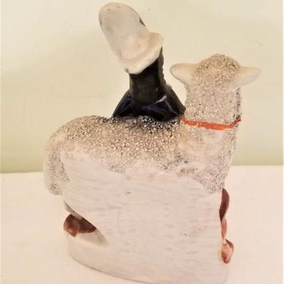 Lot #152  Antique 19th Century Staffordshire figure of woman with sheep