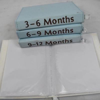 4 Small Photo Albums for Baby's First Year. Blue/Brown/Yellow