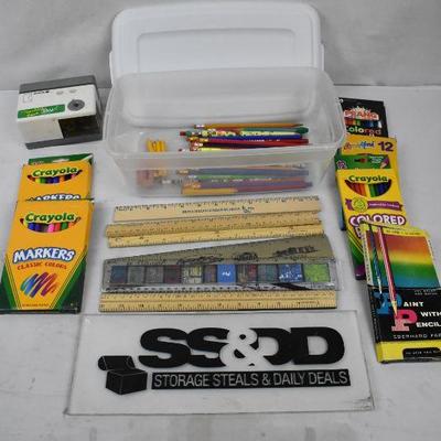 Clear Bin of Markers, Pencils, Colored Pencils, Pencil Sharpener, and Rulers