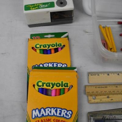 Clear Bin of Markers, Pencils, Colored Pencils, Pencil Sharpener, and Rulers
