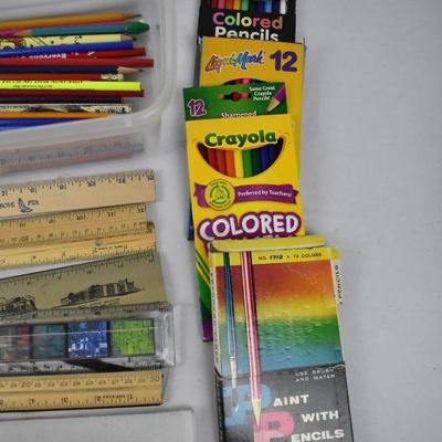 Clear Bin of Markers, Pencils, Colored Pencils, Pencil Sharpener, and Rulers