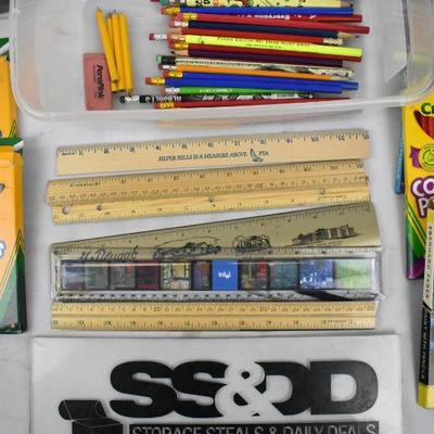 Clear Bin of Markers, Pencils, Colored Pencils, Pencil Sharpener, and Rulers