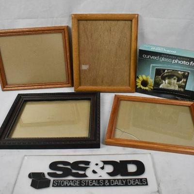 5 pc Frames: Four Wooden 8x10 (1 broken glass). 1 Curved Glass 5x7