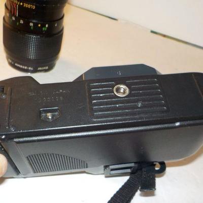 " Canon 35 mm. Camera T50 Programmed Auto with zoom lens"