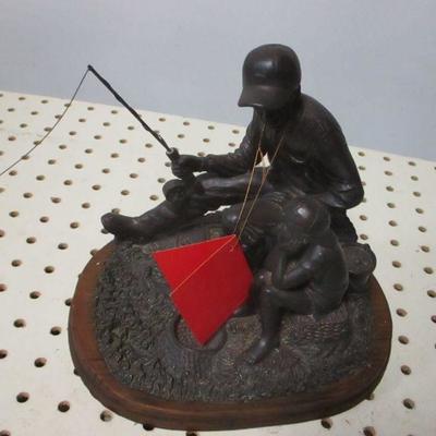 Lot 143 - Little Boy & Man Fishing Dezine Figure Statue