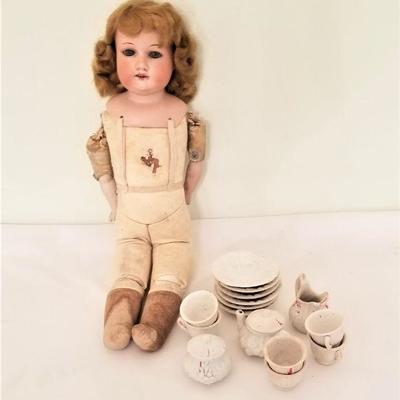 Lot #194  German Head doll and Victorian tea set