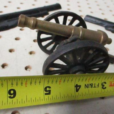 Lot 210 - Cast Iron Wall Hanging Guns & Cannon