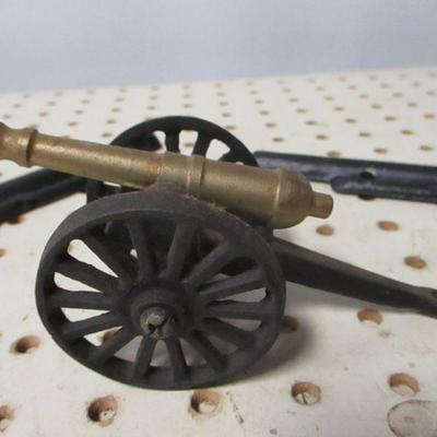 Lot 210 - Cast Iron Wall Hanging Guns & Cannon