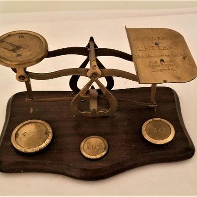 Lot #321  Antique British Brass postal scale with three weights