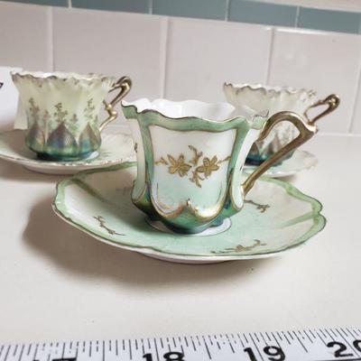 Lot 57: Unmarked Antique Demitasse Cups and Saucers