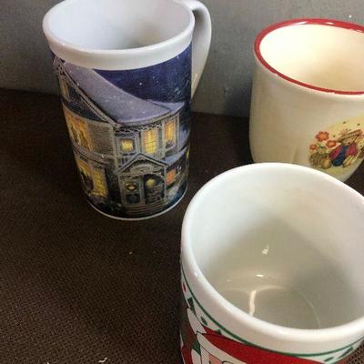 #277 (7) Holiday themed Coffee Mugs 1 is Thomas Kinkade 