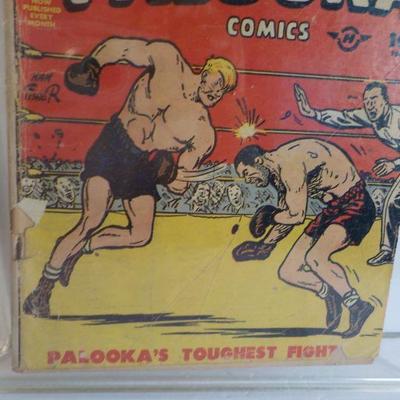 2 Famous early comic books, " Joe Palooka" and "Nancy and Sluggo."