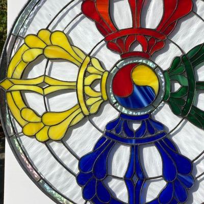 Striking Multi Color Stained Glass Window featuring Red Yellow Green and Blue