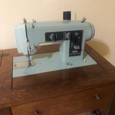 Vintage enclosed sewing machine