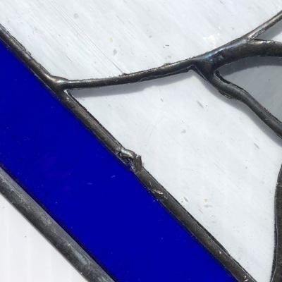 Blue Octagon Stained Glass of Dolphins Swimming in Waves