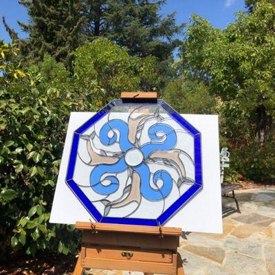 Blue Octagon Stained Glass of Dolphins Swimming in Waves