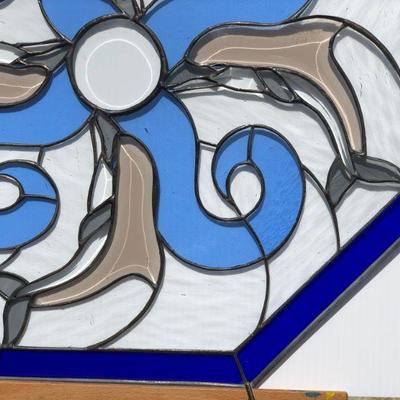 Blue Octagon Stained Glass of Dolphins Swimming in Waves