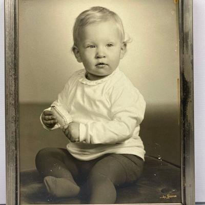 Framed picture of child by Neefus