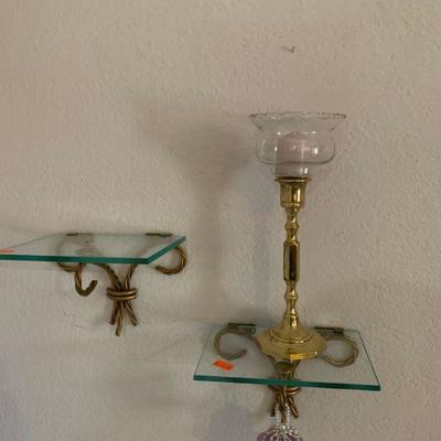 Glass shelves with brass votive candle holder