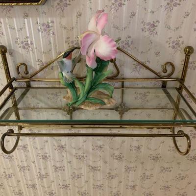 Glass shelf with figurine