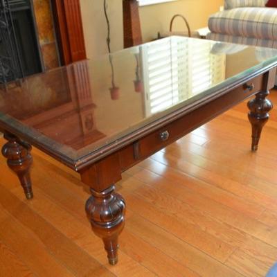 Lot 11. Ethan Allen wood coffee table with glass top