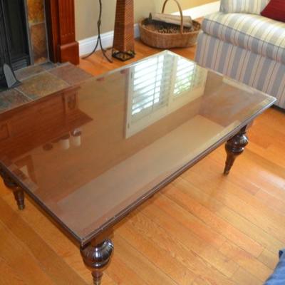 Lot 11. Ethan Allen wood coffee table with glass top