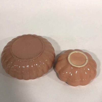 .154. Seven Pink Pottery Pieces