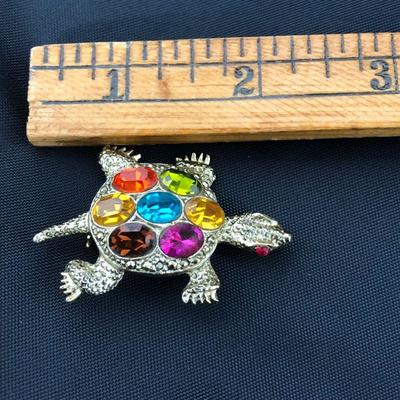 .177. Figural Brooches