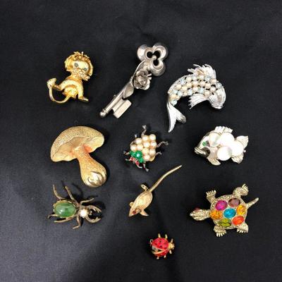 .177. Figural Brooches