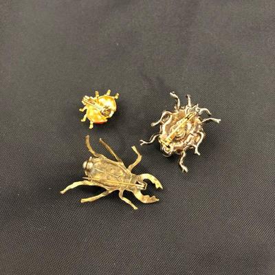 .177. Figural Brooches