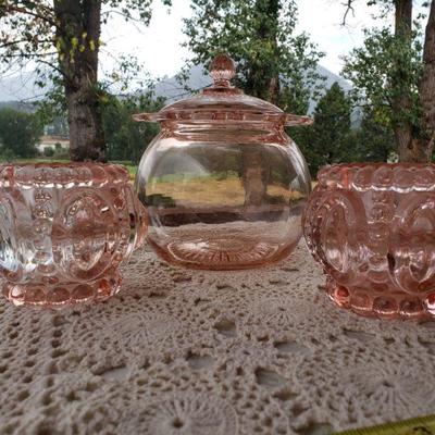 Lot 106: Antique Pink Glass Jar with Lid and 2 Repro Glass Candleholders 