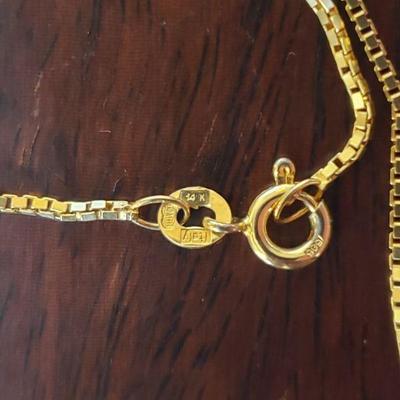 Lot 288: 14k Yellow Gold 17" Necklace with a Diamond 