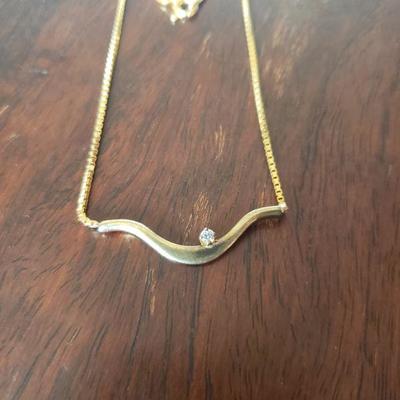 Lot 288: 14k Yellow Gold 17" Necklace with a Diamond 